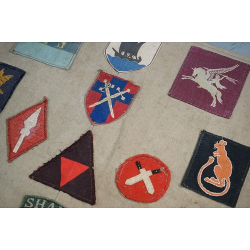 433 - A Collection Of Approx Twenty Five British Military Cloth Badges, Sewn To Cloth And Mounted On Board... 