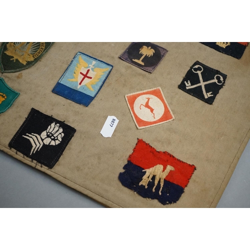 433 - A Collection Of Approx Twenty Five British Military Cloth Badges, Sewn To Cloth And Mounted On Board... 