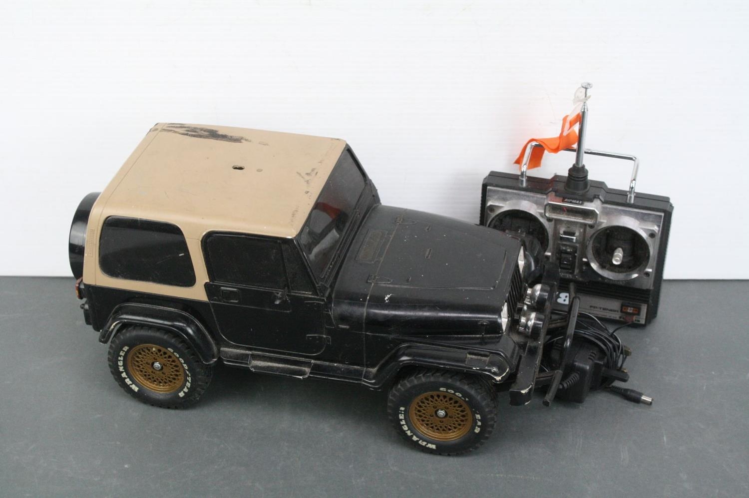 A Tamiya Jeep Wrangler 1 10 scale RC street car c.1994 ABS Body on CC 01 chassis together with Futab