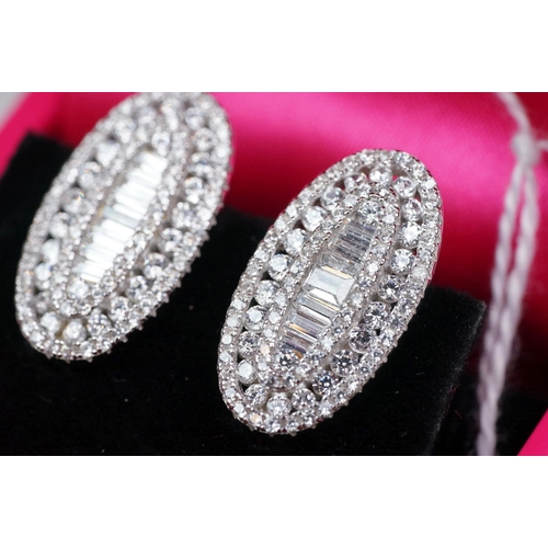 337 - Pair of silver and CZ set stud earrings
