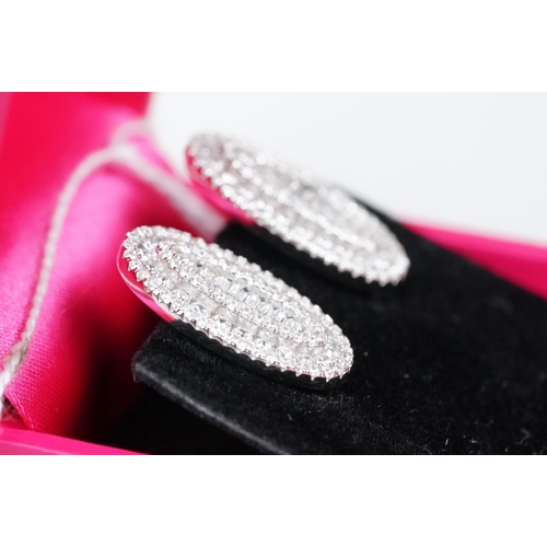 337 - Pair of silver and CZ set stud earrings