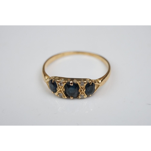 342 - Three rings: Diamond and emerald three stone 18ct yellow gold ring, central cushion cut diamond with... 