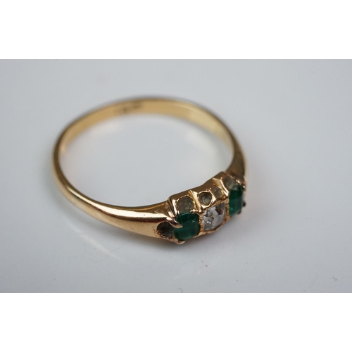 342 - Three rings: Diamond and emerald three stone 18ct yellow gold ring, central cushion cut diamond with... 