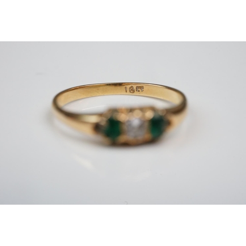 342 - Three rings: Diamond and emerald three stone 18ct yellow gold ring, central cushion cut diamond with... 