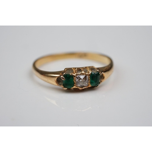 342 - Three rings: Diamond and emerald three stone 18ct yellow gold ring, central cushion cut diamond with... 