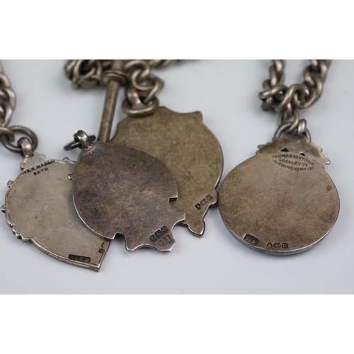 348 - A collection of Stirling silver watch fobs together with two Albert chains and a silver ring.