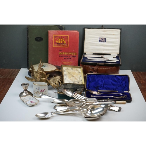 298 - A box of mixed collectables to include a hallmarked silver candlestick, a cased hallmarked silver fo... 