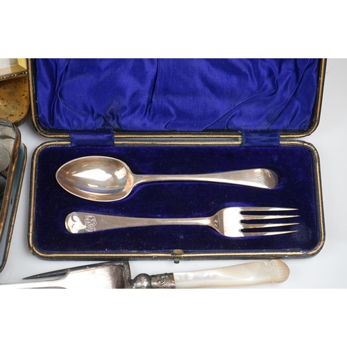 298 - A box of mixed collectables to include a hallmarked silver candlestick, a cased hallmarked silver fo... 