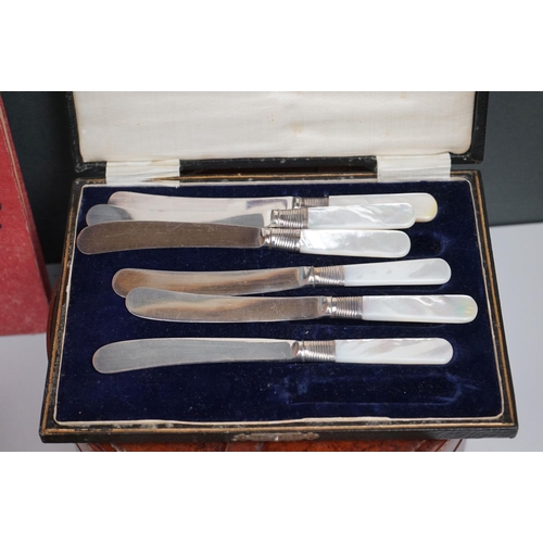 298 - A box of mixed collectables to include a hallmarked silver candlestick, a cased hallmarked silver fo... 