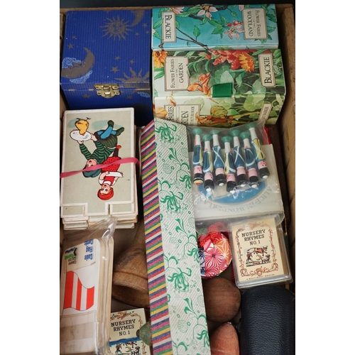 304 - A box of mixed collectables to include a antique pair of children's shoes, cutthroat razor, cigarett... 
