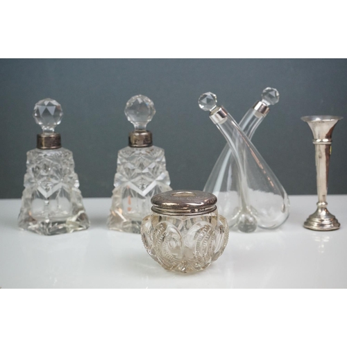 312 - Collection of silver items, to include scent bottles with crystal stoppers, bud vase, oil & vinegar ... 