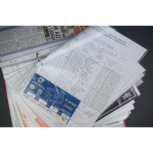 321 - Football - England World Cup 2010 qualifying, a binder containing home & away teamsheets, tickets, p... 