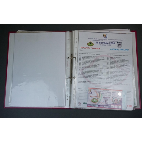 321 - Football - England World Cup 2010 qualifying, a binder containing home & away teamsheets, tickets, p... 