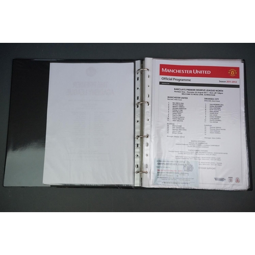 323 - Football - Manchester United fc reserve and youth teams 2011/12, a binder containing approx. 50 home... 