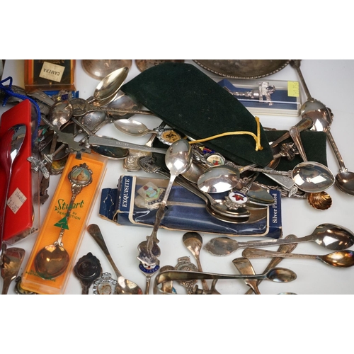 334 - A mixed box of silver plated items to include collectors spoons, candle holder and sugar shaker.