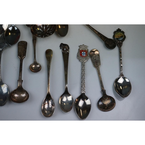 334 - A mixed box of silver plated items to include collectors spoons, candle holder and sugar shaker.