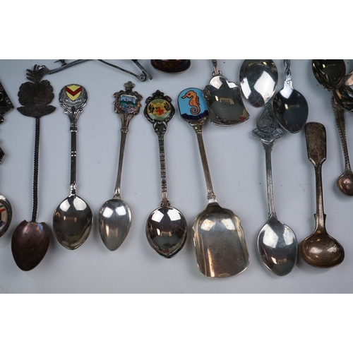 334 - A mixed box of silver plated items to include collectors spoons, candle holder and sugar shaker.