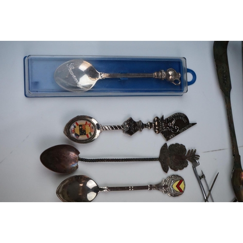 334 - A mixed box of silver plated items to include collectors spoons, candle holder and sugar shaker.