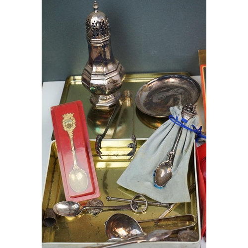 334 - A mixed box of silver plated items to include collectors spoons, candle holder and sugar shaker.