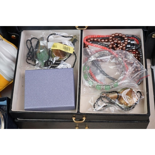 335 - A large collection of mainly vintage costume jewellery to include silver bangles and other silver ex... 