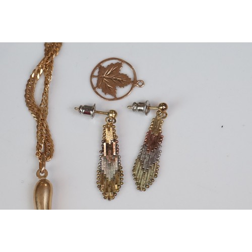 350A - A collection of gold and yellow metal jewellery to include necklaces, pendants and earrings.