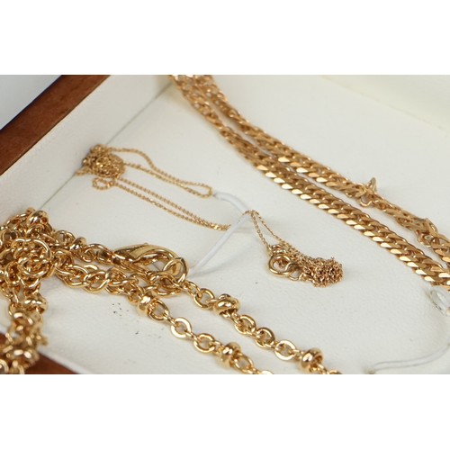 350A - A collection of gold and yellow metal jewellery to include necklaces, pendants and earrings.