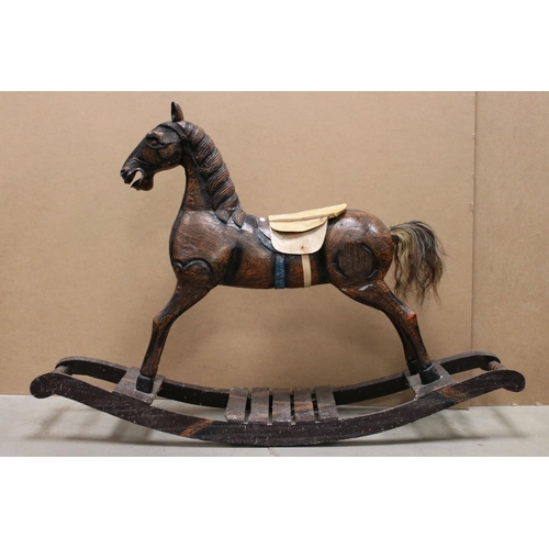 43 - Wooden Rocking Horse raised on a bow rocker, 124cms long x 85cms high
