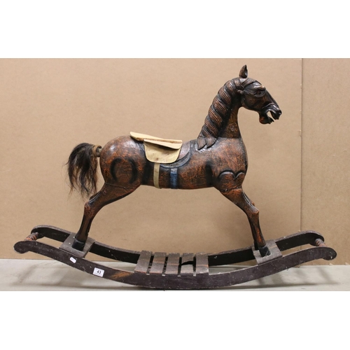 43 - Wooden Rocking Horse raised on a bow rocker, 124cms long x 85cms high