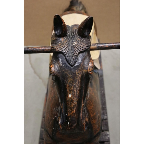 43 - Wooden Rocking Horse raised on a bow rocker, 124cms long x 85cms high