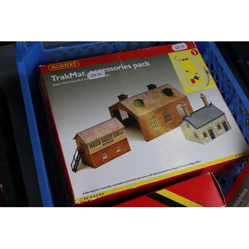 132 - Six boxed Hornby OO gauge trackside accessories to include R481 Footbridge, R8084 TrakMat, 2 x R514 ... 