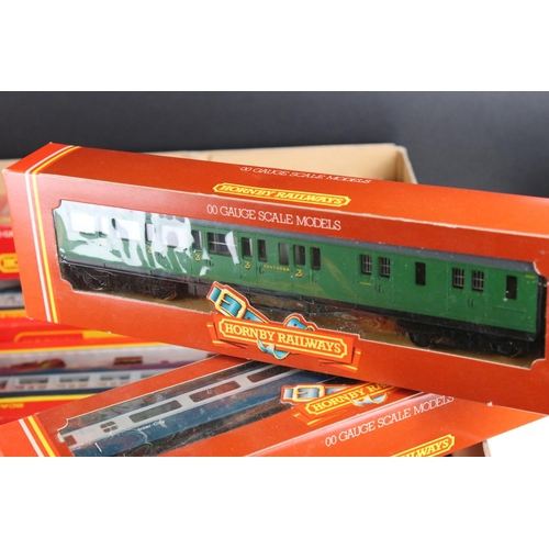 136 - 28 boxed Hornby OO gauge items of rolling stock to include coaches and wagons featuring R427, R895, ... 