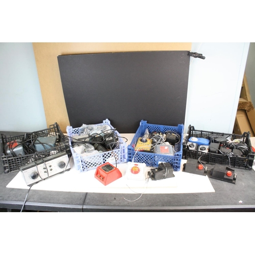 165 - Large group of model railway controllers, power units, leads etc featuring H and M, Hornby, Lima etc... 