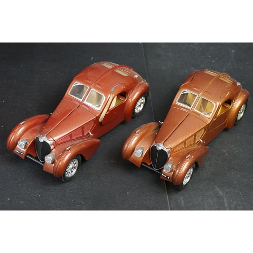 402 - Nine 1/18-1/24 diecast & plastic models to include mainly Burago examples