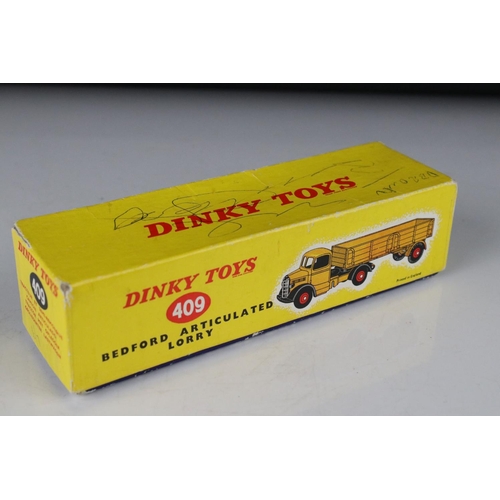 430 - Three boxed diecast models to include 2 x Dinky featuring 409 Bedford Articulated Lorry (graffiti to... 