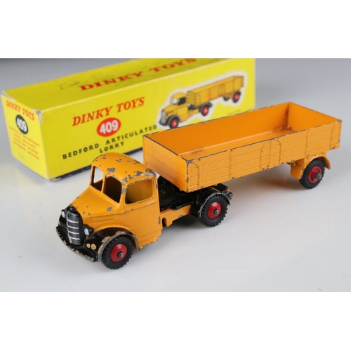 430 - Three boxed diecast models to include 2 x Dinky featuring 409 Bedford Articulated Lorry (graffiti to... 