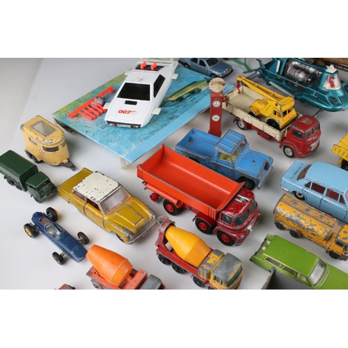 457 - Around 35 mid 20th play worn diecast models to include Matchbox Lesney, Dinky & Corgi featuring Corg... 