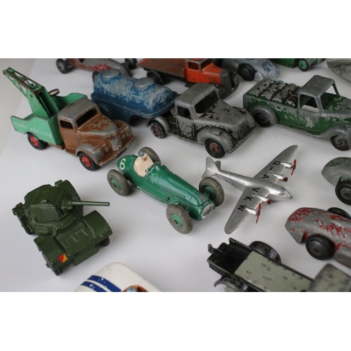 460 - Around 32 mid 20th C play worn diecast models to include Timpo & Dinky commercial, planes and road e... 