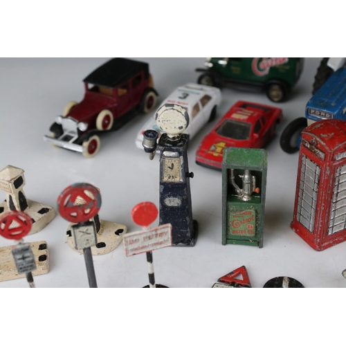 462 - Collection of various mid 20th C play worn metal roadside accessories to include petrol pumps, traff... 