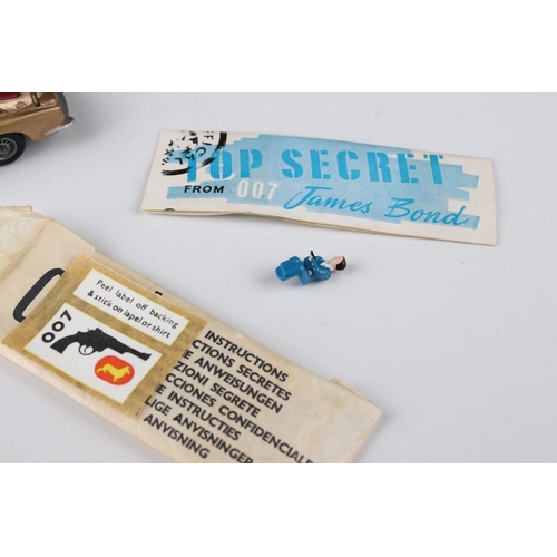 512 - Boxed Corgi 261 James Bond Aston Martin DB5 diecast model with secret instructions, paper bag and 2 ... 