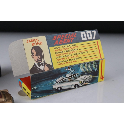 512 - Boxed Corgi 261 James Bond Aston Martin DB5 diecast model with secret instructions, paper bag and 2 ... 