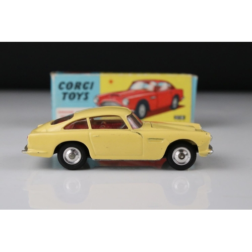 515 - Two boxed Corgi diecast models to include 218 Aston Martin DB4 in yellow with red interior and 219 P... 