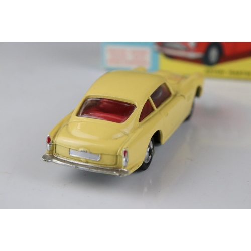 515 - Two boxed Corgi diecast models to include 218 Aston Martin DB4 in yellow with red interior and 219 P... 