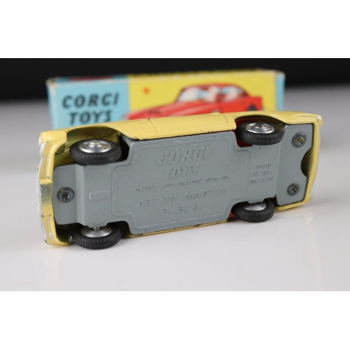 515 - Two boxed Corgi diecast models to include 218 Aston Martin DB4 in yellow with red interior and 219 P... 