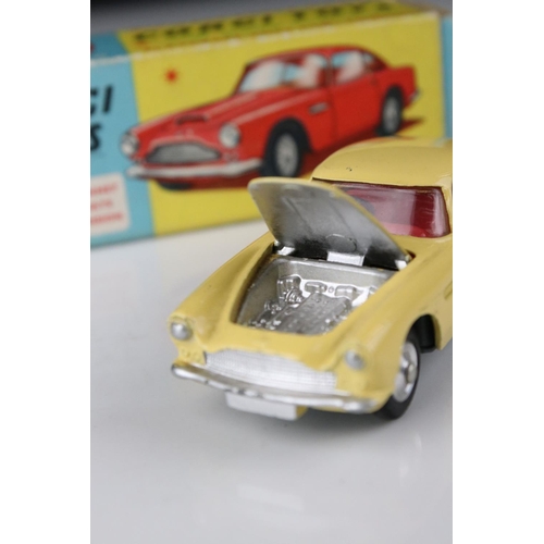 515 - Two boxed Corgi diecast models to include 218 Aston Martin DB4 in yellow with red interior and 219 P... 