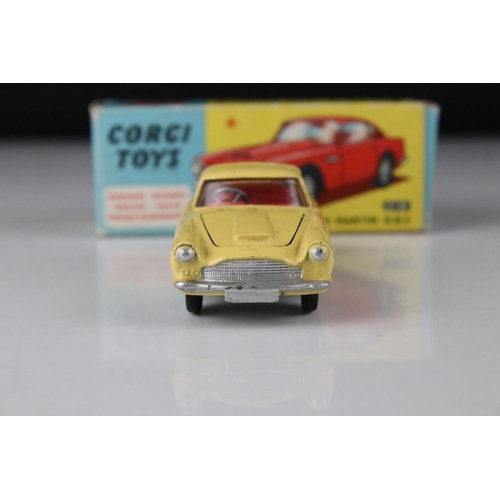 515 - Two boxed Corgi diecast models to include 218 Aston Martin DB4 in yellow with red interior and 219 P... 