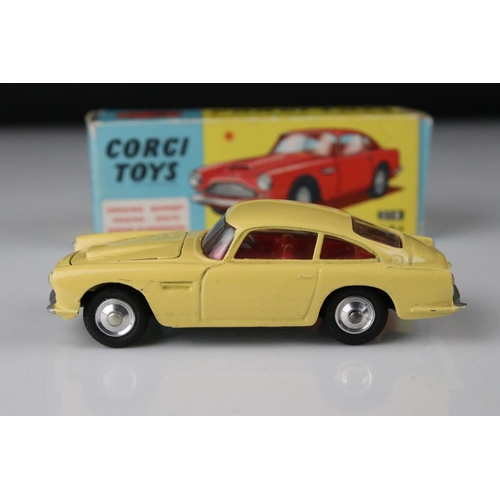 515 - Two boxed Corgi diecast models to include 218 Aston Martin DB4 in yellow with red interior and 219 P... 