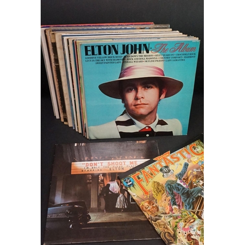 81 - Vinyl - 25 Elton John LP's including some duplication.  Titles include Ice On Fire, Caribou, The Bes... 