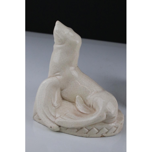 42 - Pair of Art Deco ceramic bookends in the form of seals