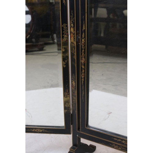 643 - Black Lacquered Triptych Dressing Mirror with chinoiserie decoration, 69cms high