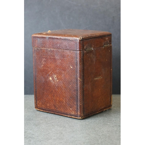 185 - An early 20th century brass cased carriage clock, complete with travel case and key.